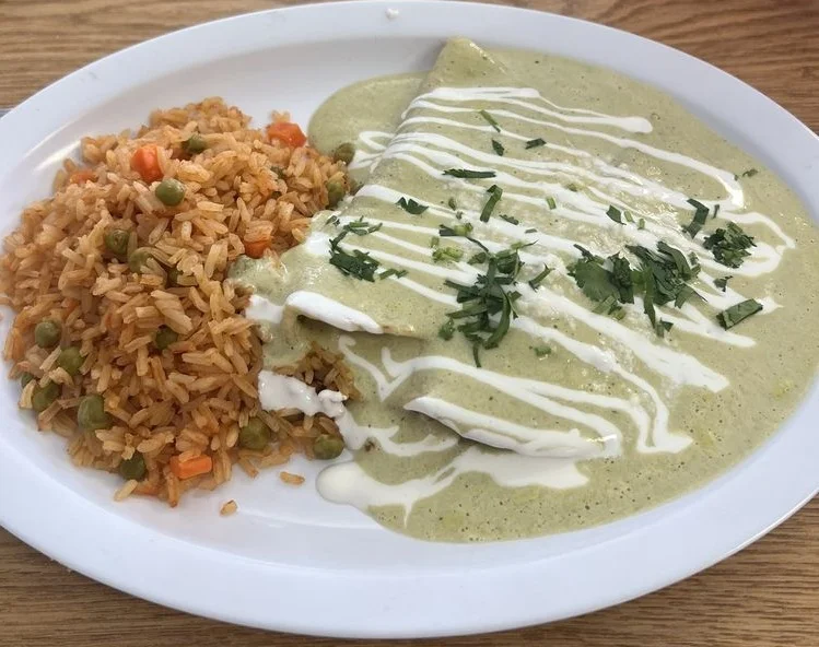 Enchiladas verdes served with Mexican rice