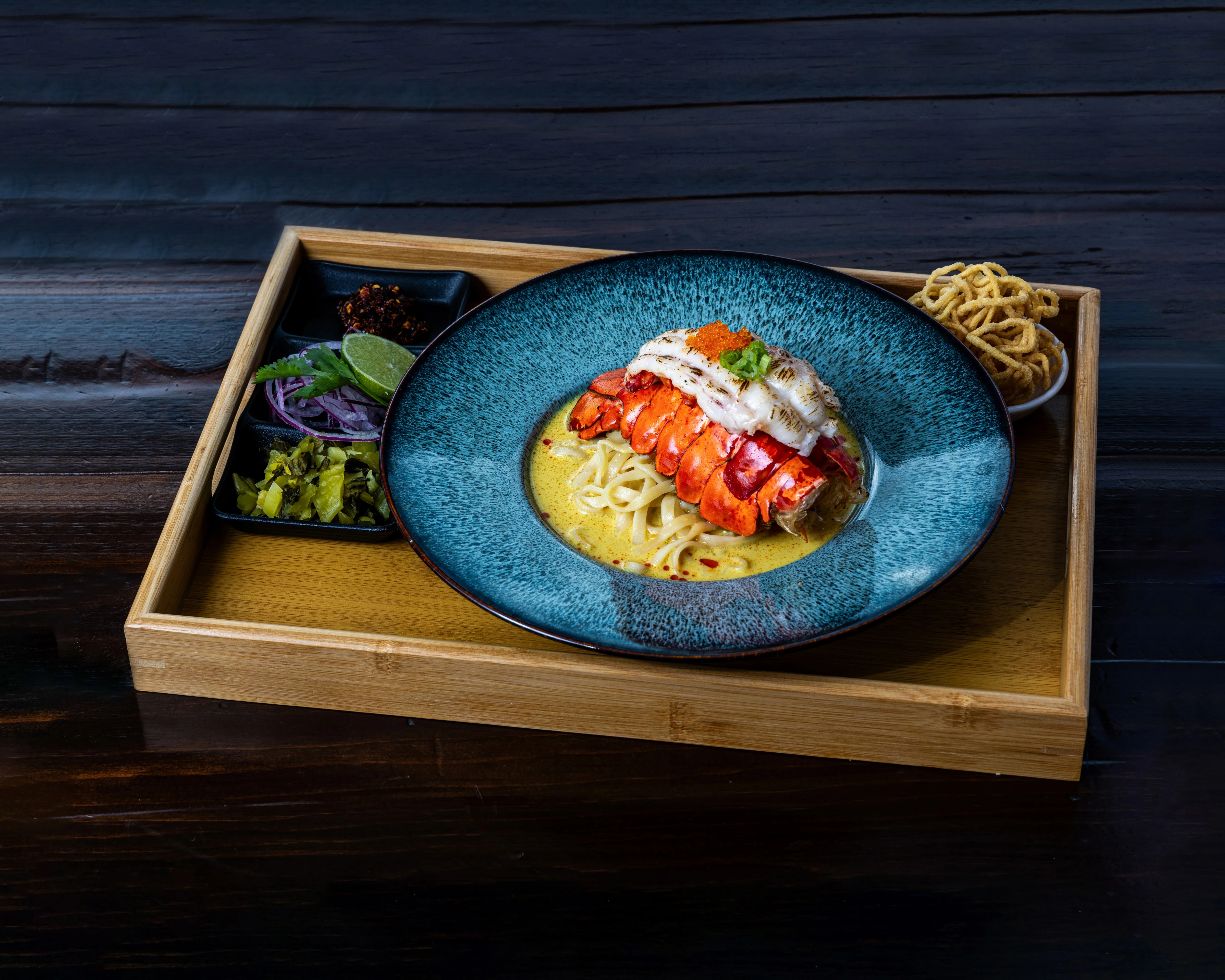 Plate of Pad Thai from Saoho Thai Cuisine with vibrant colors and garnishes.