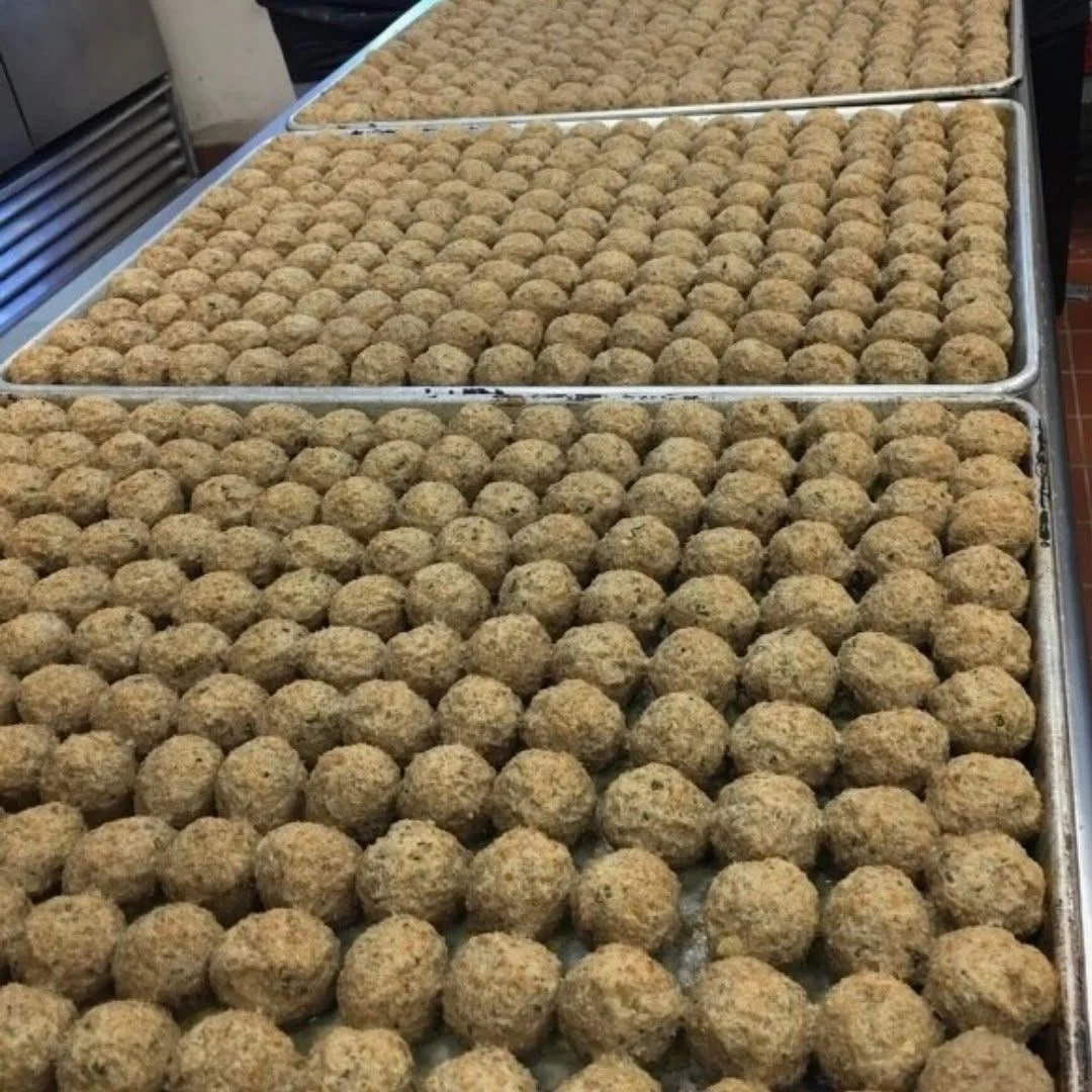 Trays filled with neatly arranged round food balls.