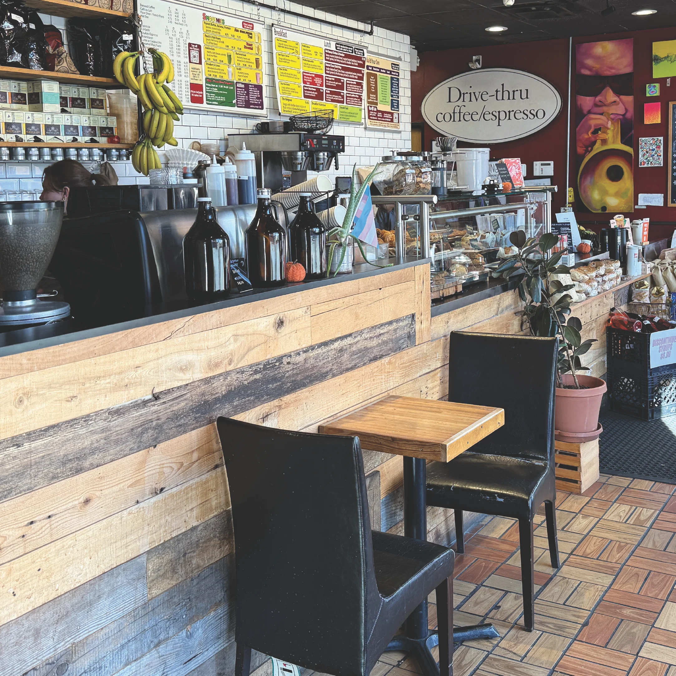 Cozy coffee shop interior with rustic decor and drive-thru service