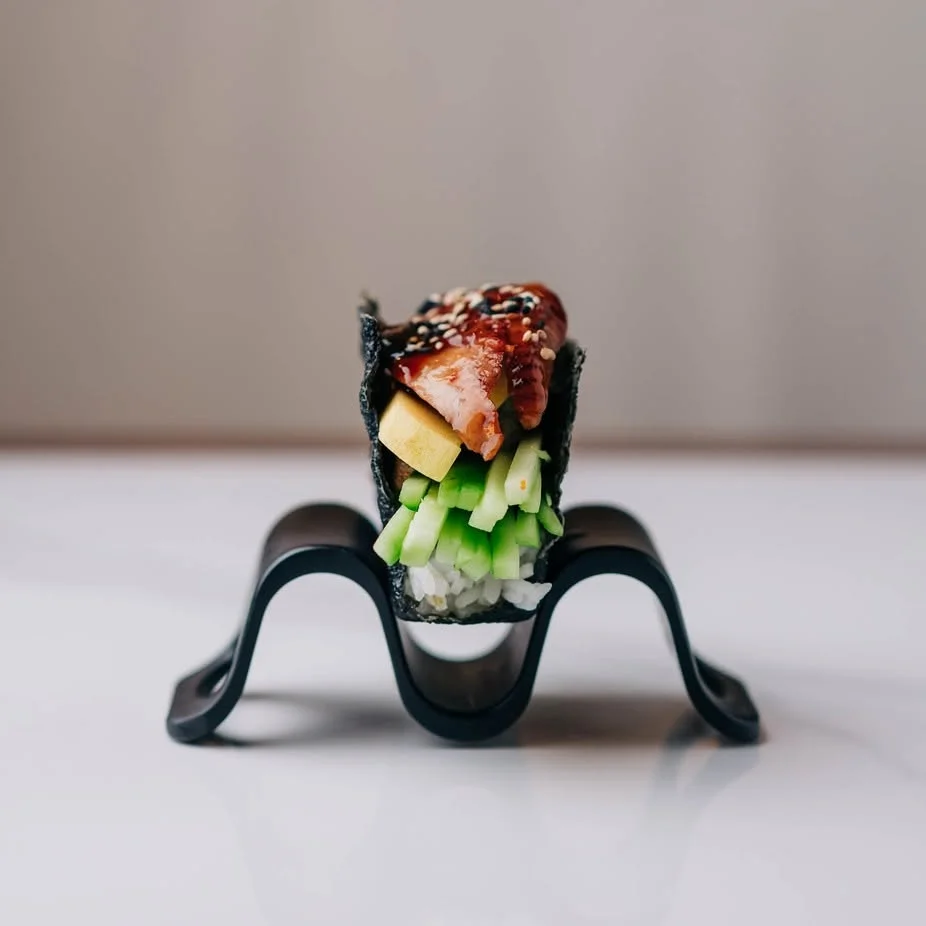Japanese sushi roll with eel and vegetables