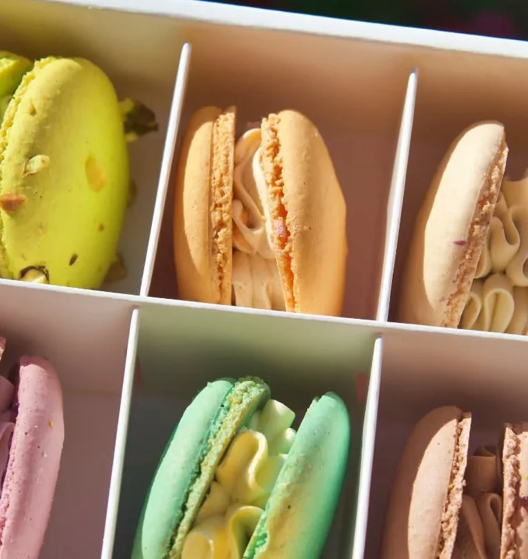 Colorful French macarons in a decorative box
