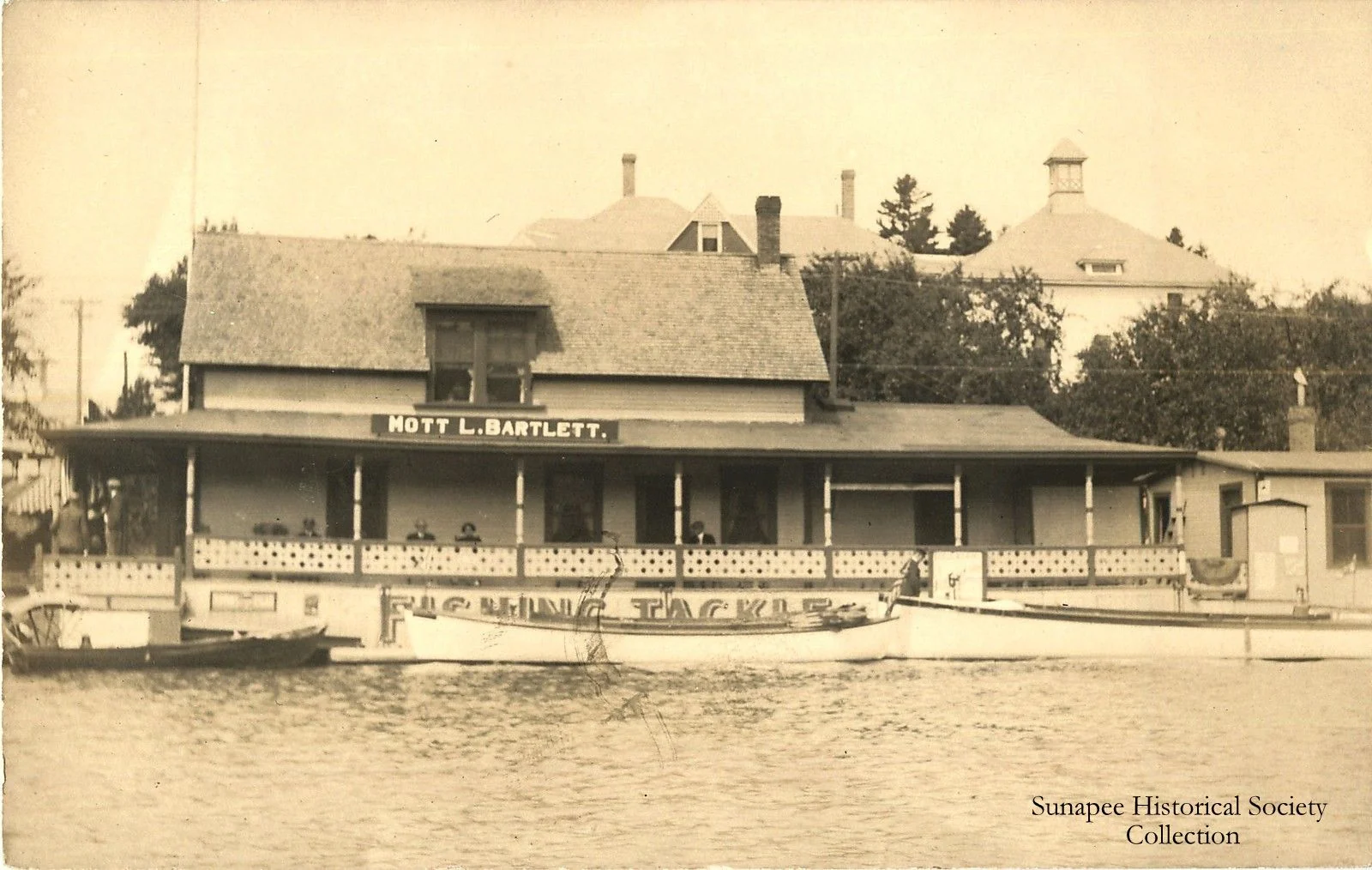 Historic lakeside building with fishing tackle shop