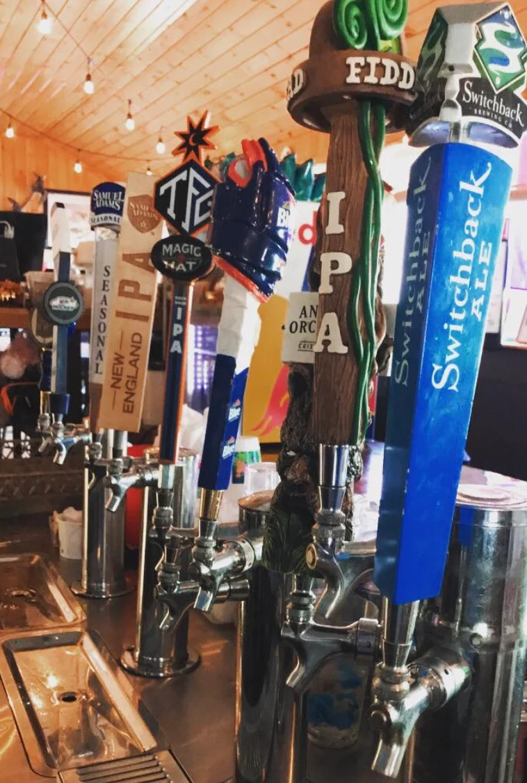 Craft beer taps featuring various local brews