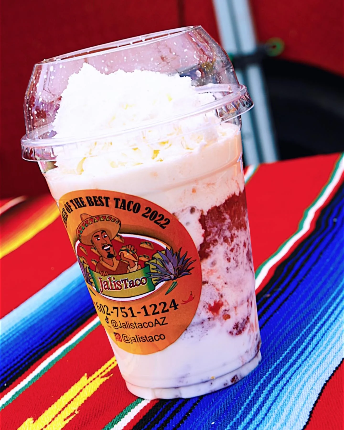Refreshing Mexican dessert drink in a clear cup with whipped cream