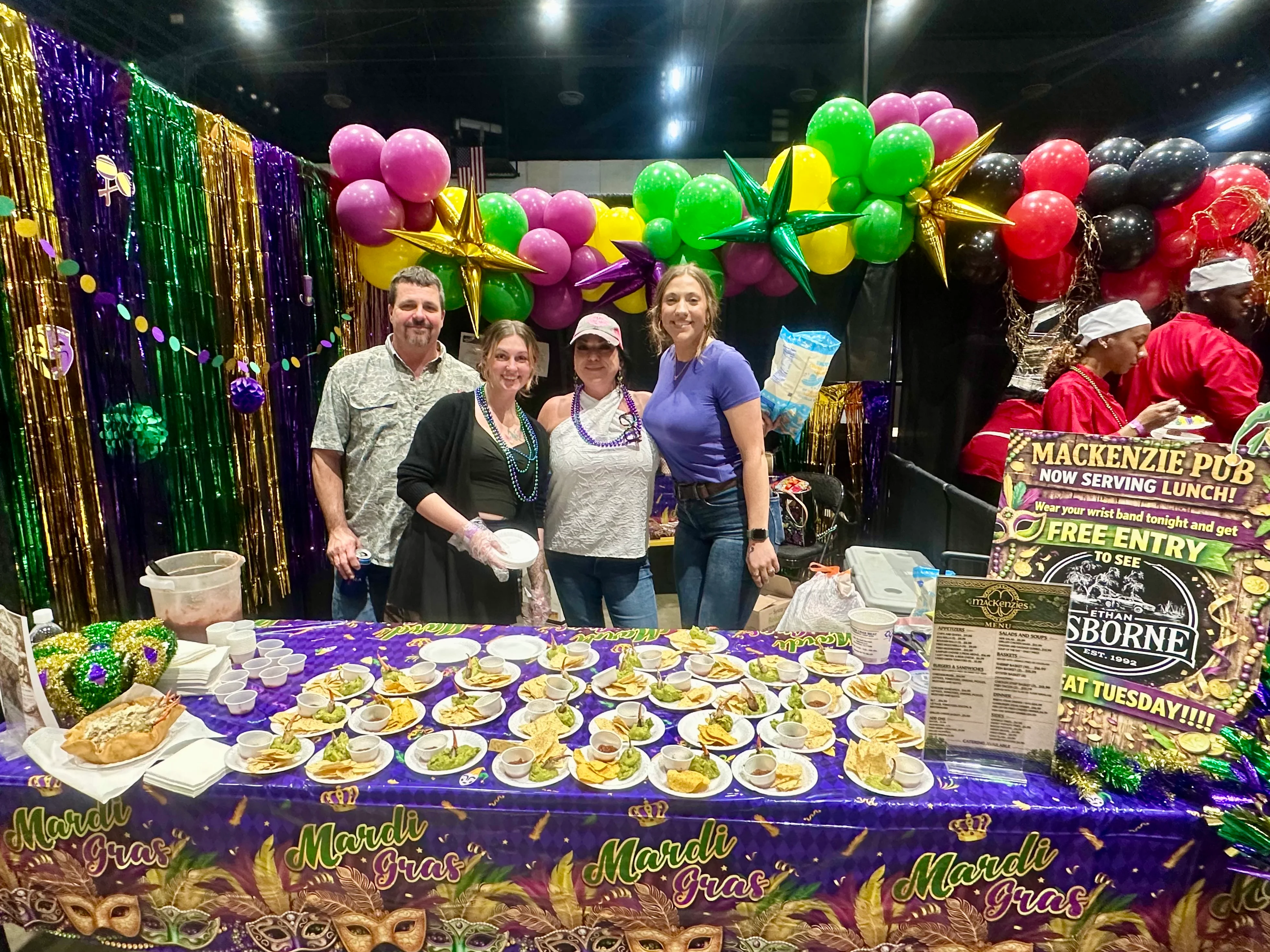 Mardi Gras food sampling with colorful decorations