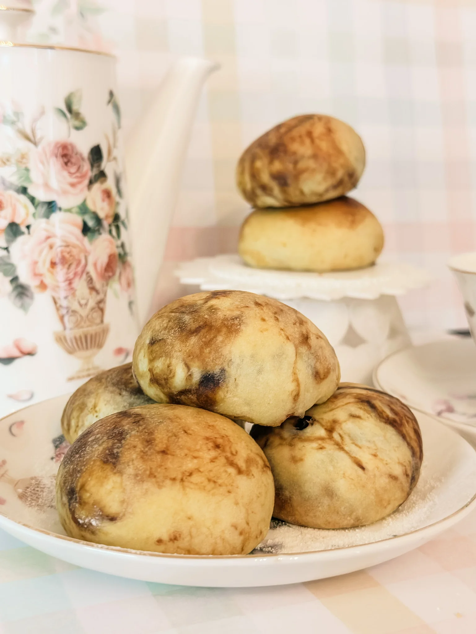 Chinese bao buns served on a decorative plate