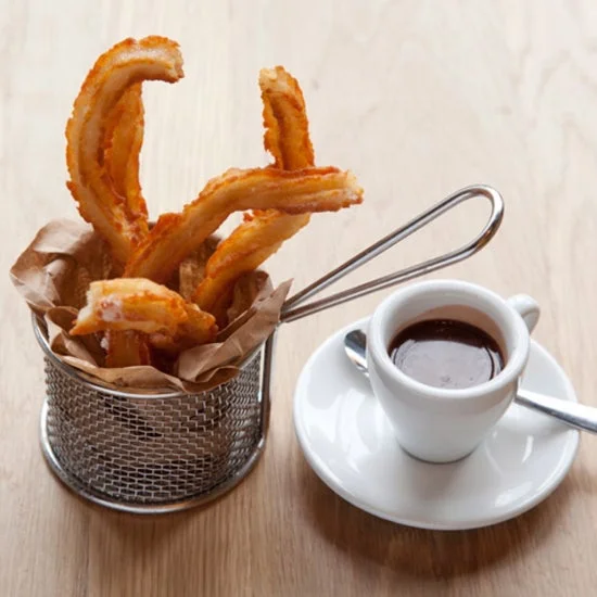 Churros served with rich chocolate sauce