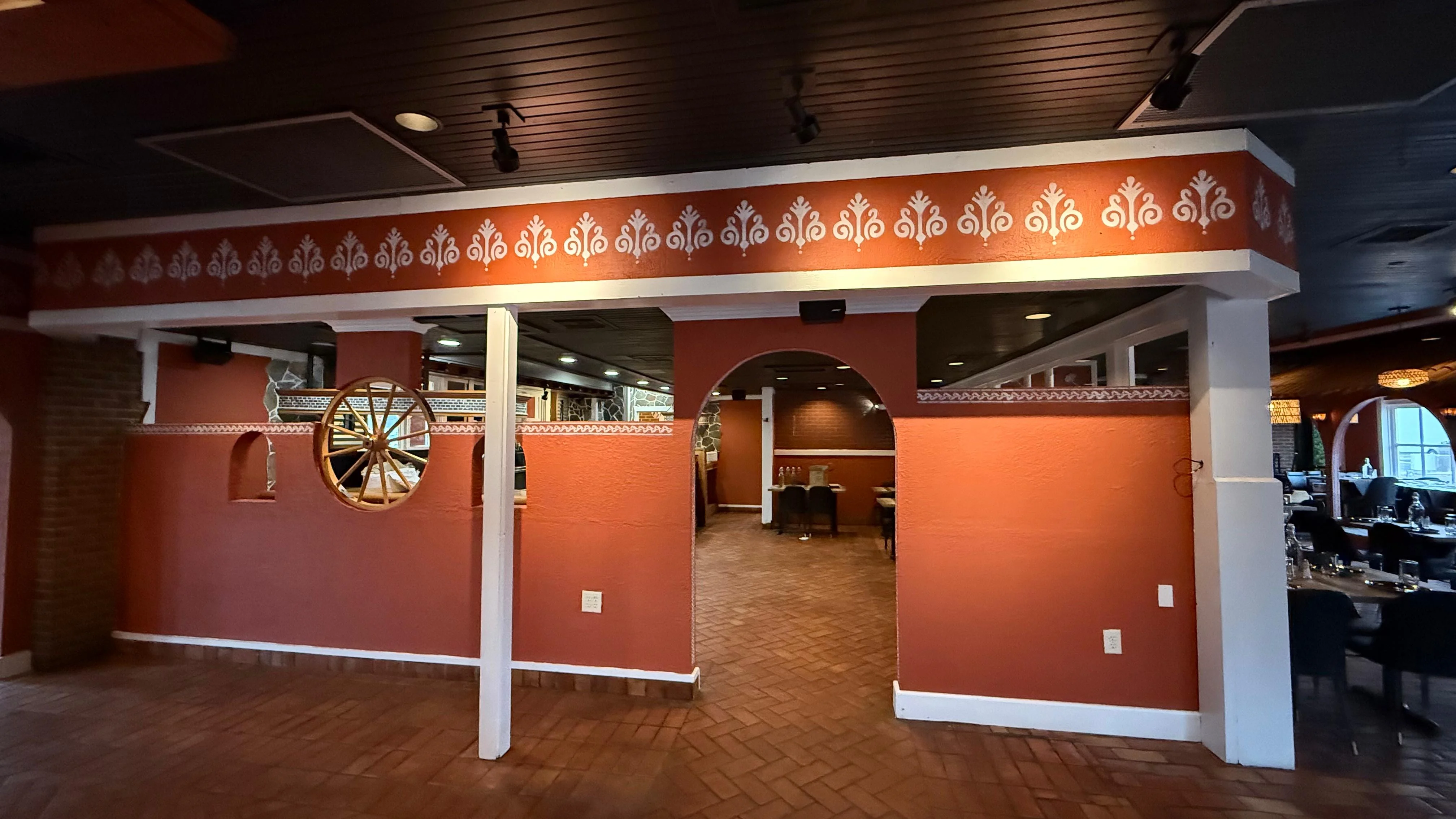 Cozy restaurant interior with warm orange walls and decorative accents