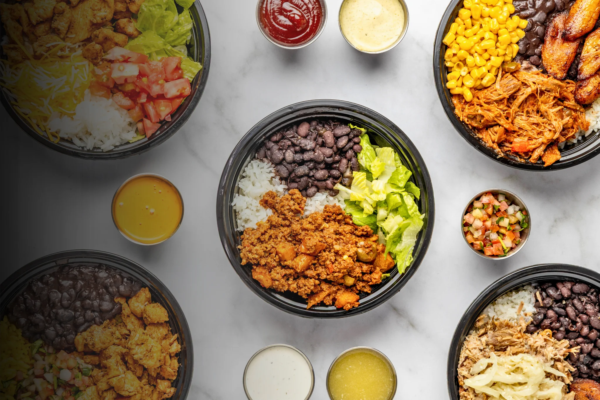 Colorful Mexican burrito bowls with rice and toppings