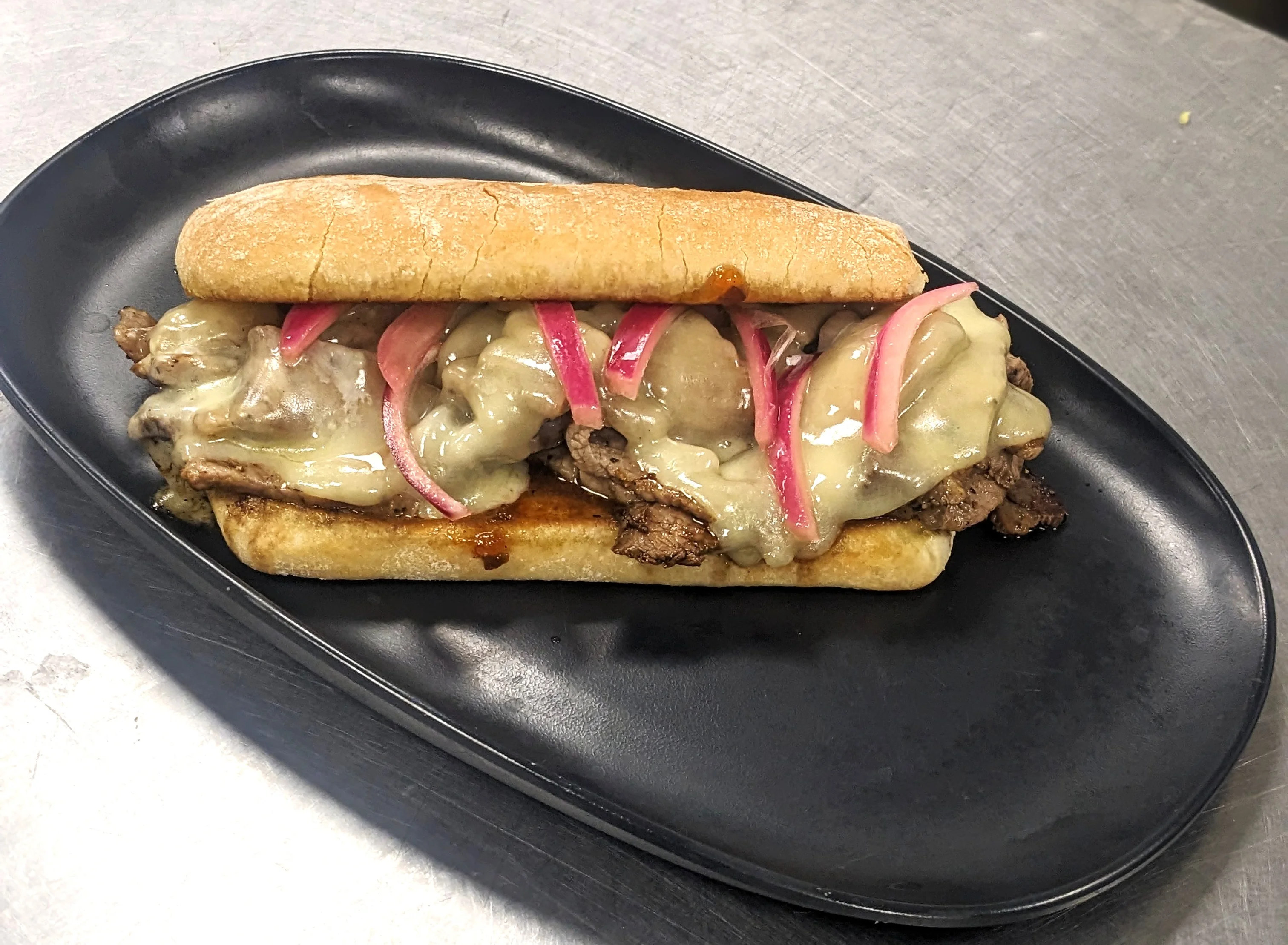 Prime Beef and Cheddar with pickled onions