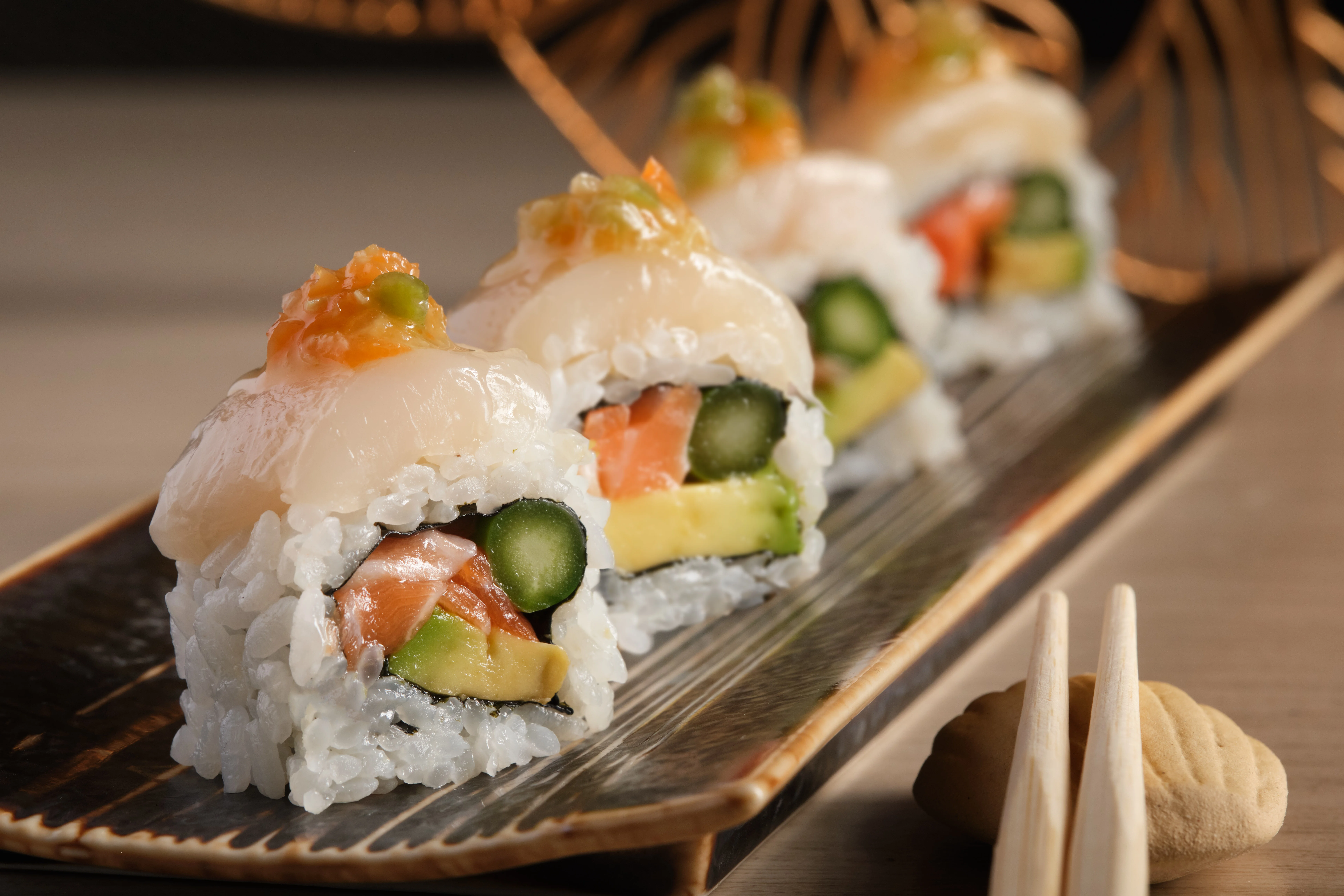 Artfully arranged sushi rolls with fresh seafood and vegetables