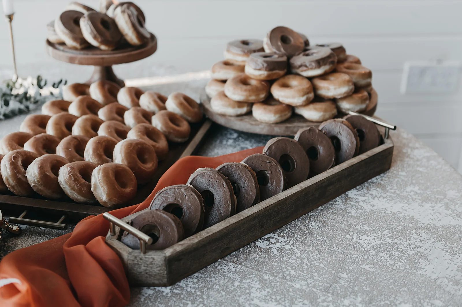 Assorted donuts on a rustic wooden display