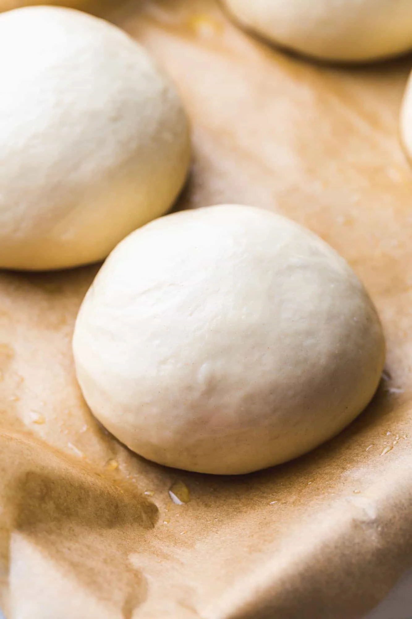 Freshly kneaded pizza dough balls ready for baking