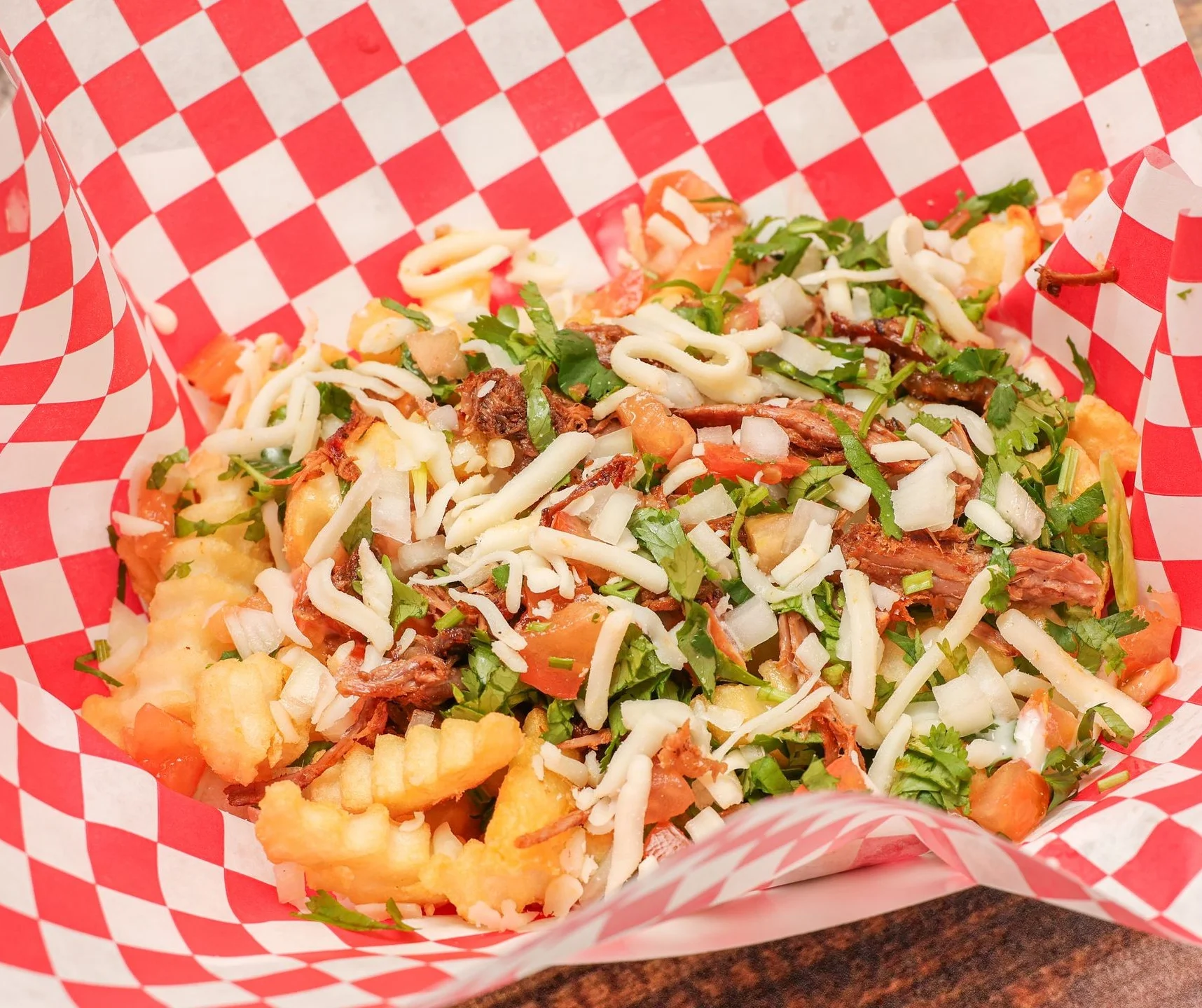 Loaded Mexican nachos with toppings and cheese