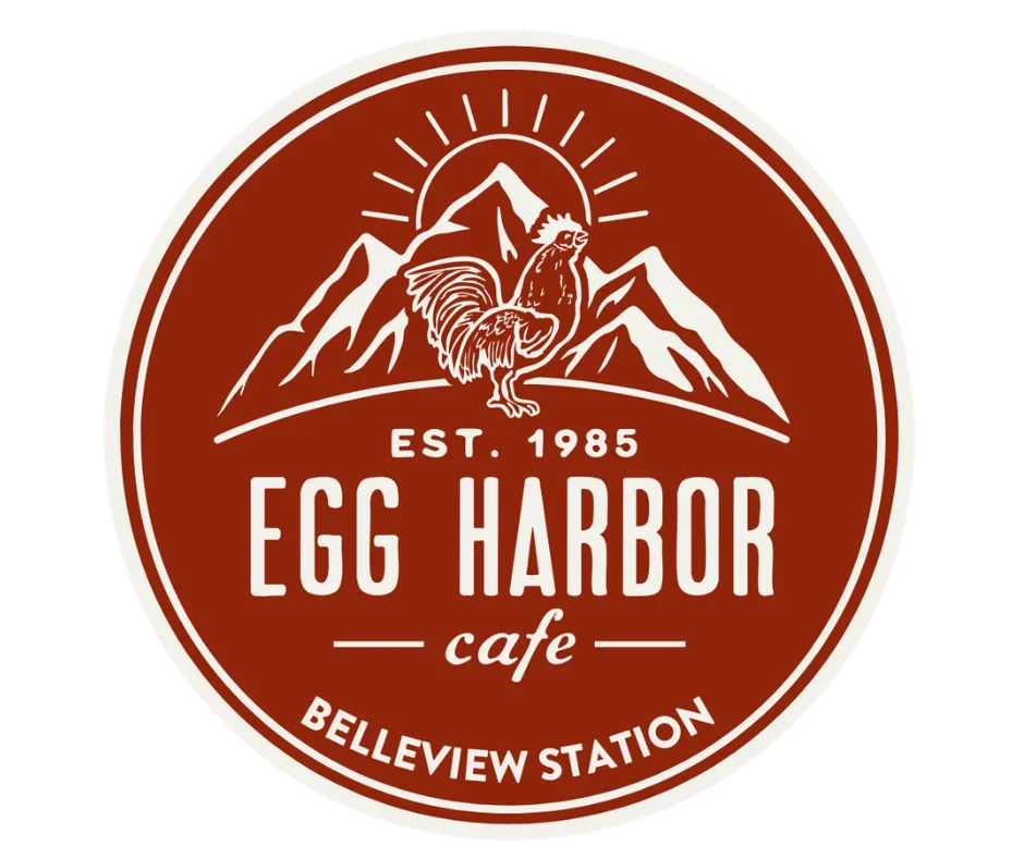Logo of Egg Harbor Cafe featuring mountains and a rooster