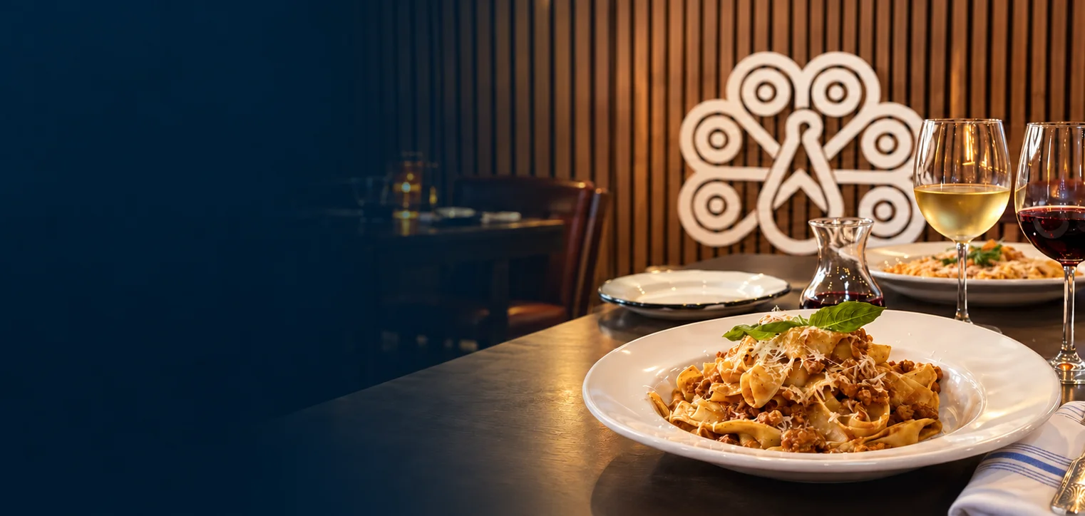 Pasta and wine served inside Tavolina44 in Katy