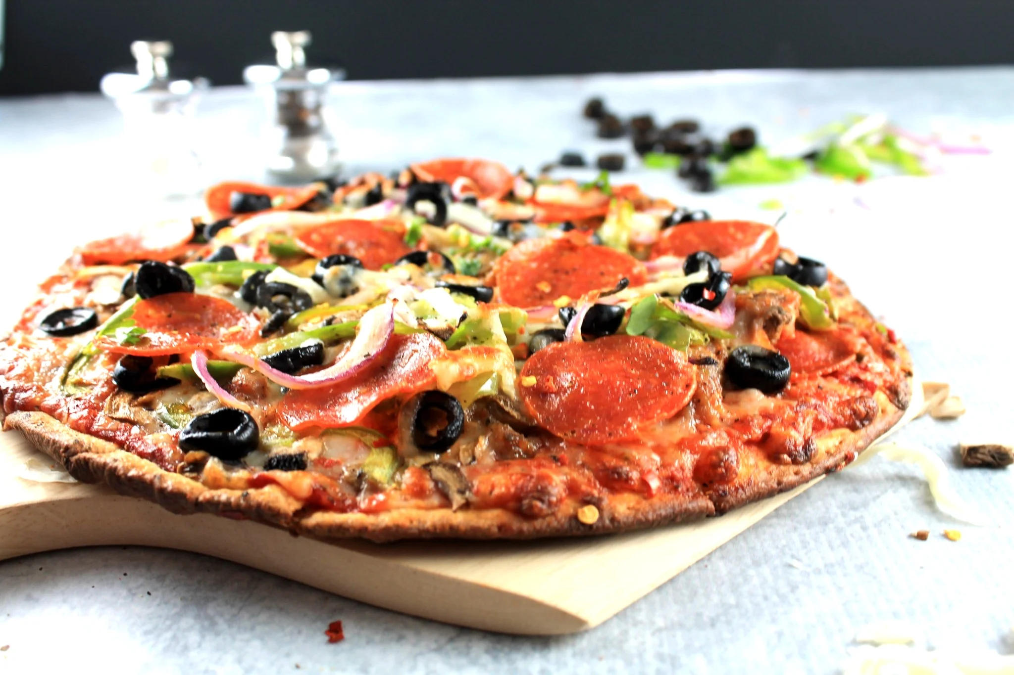 Detroit-style pizza with a crispy crust and toppings.