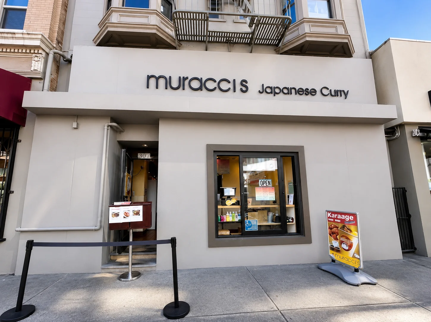 Exterior of Muracci's Japanese Curry restaurant with the main entrance and storefront signage in San Francisco.
