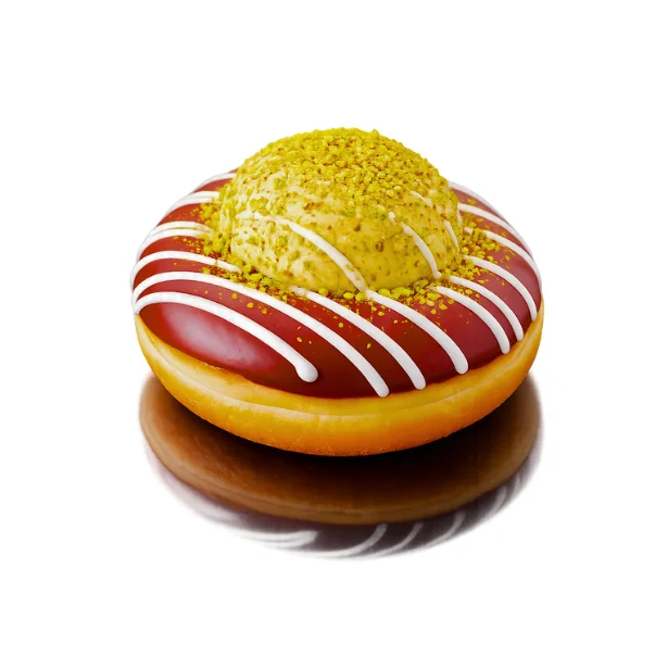 Dubai Chocolate brioche donut with chocolate glaze, white chocolate drizzle, and pistachio crumbles