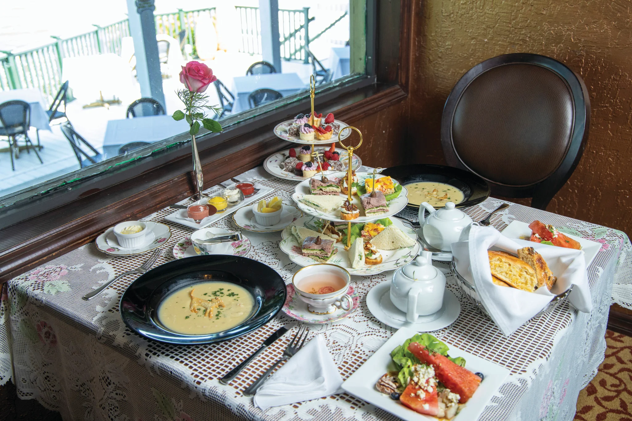 Elegant afternoon tea set with assorted pastries and sandwiches