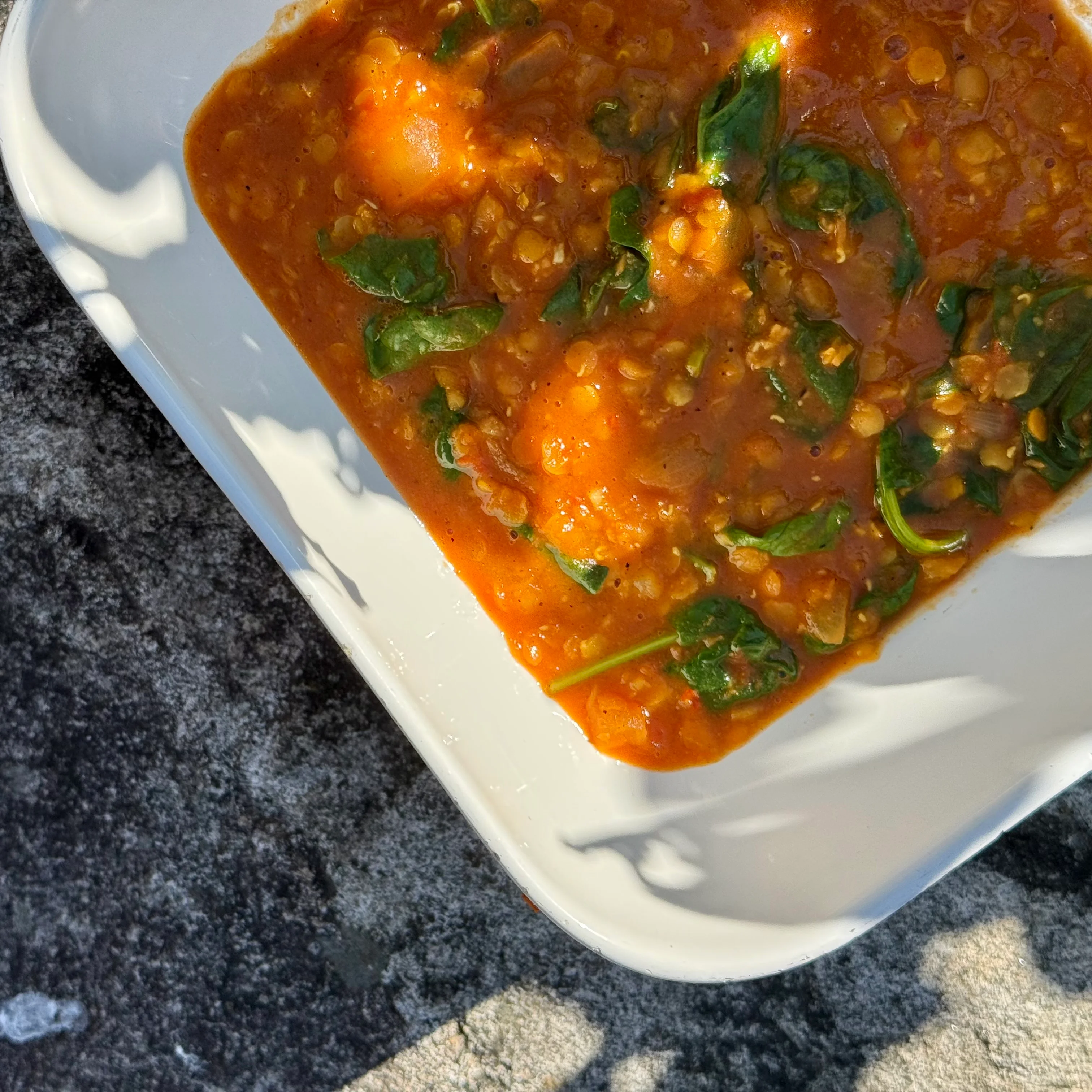 Bowl of Indian dal with spinach and spices