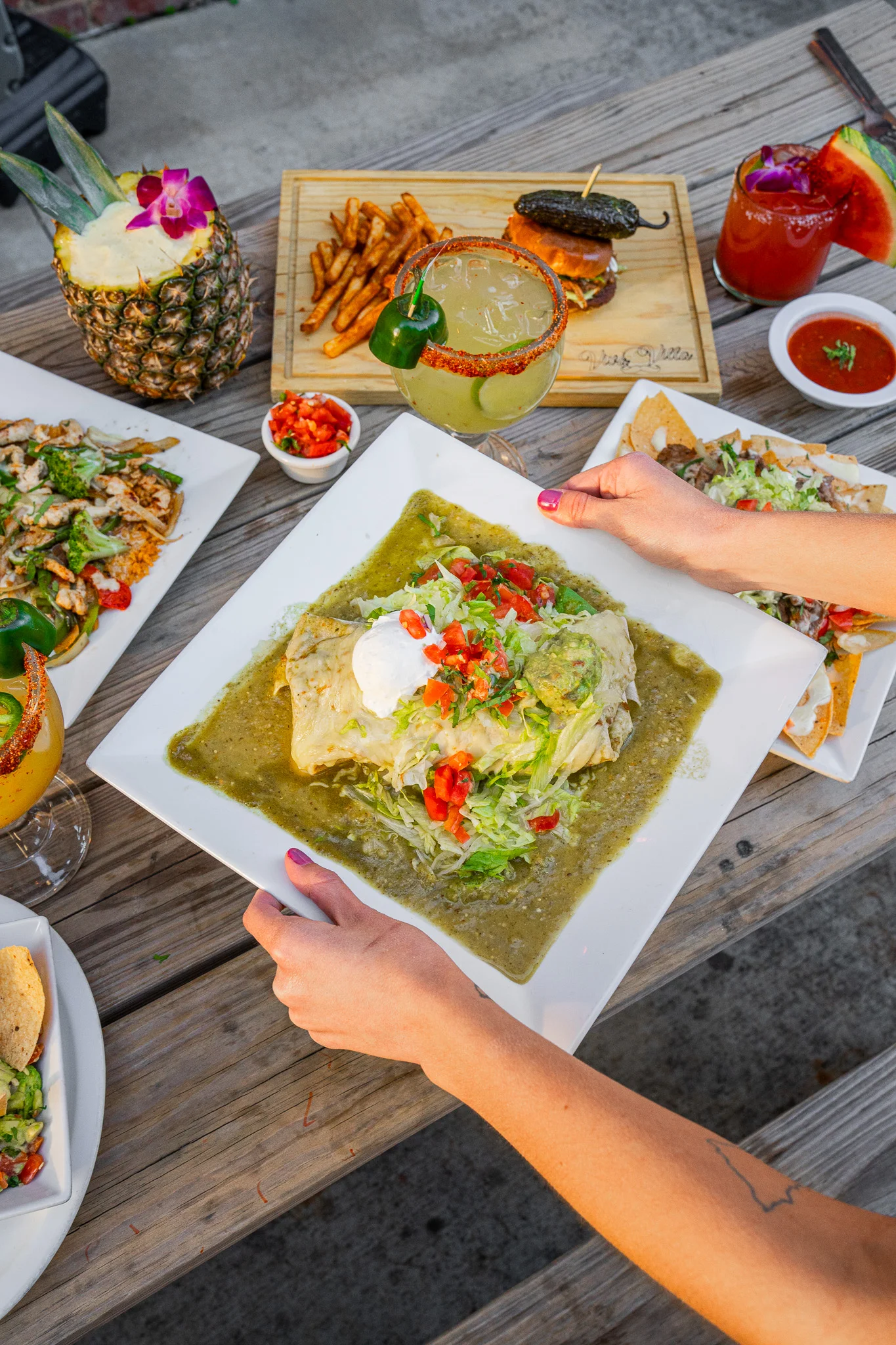Delicious Mexican enchiladas with green sauce and toppings