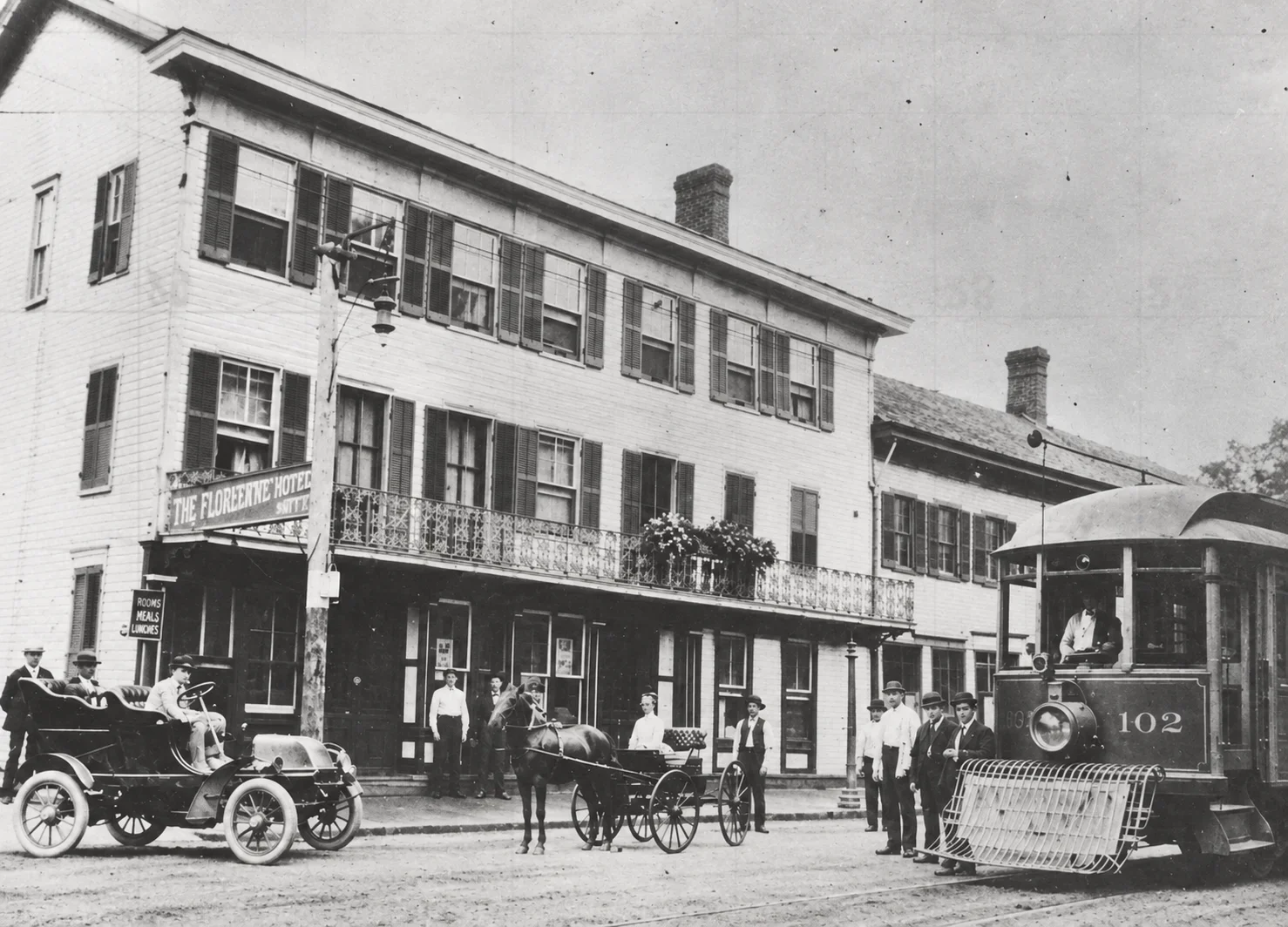 Historic Florentine exterior with streetcar and vintage automobiles