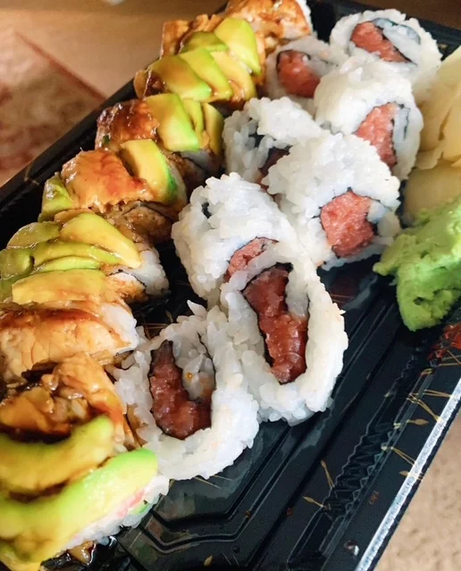 Assorted sushi rolls including California and eel rolls