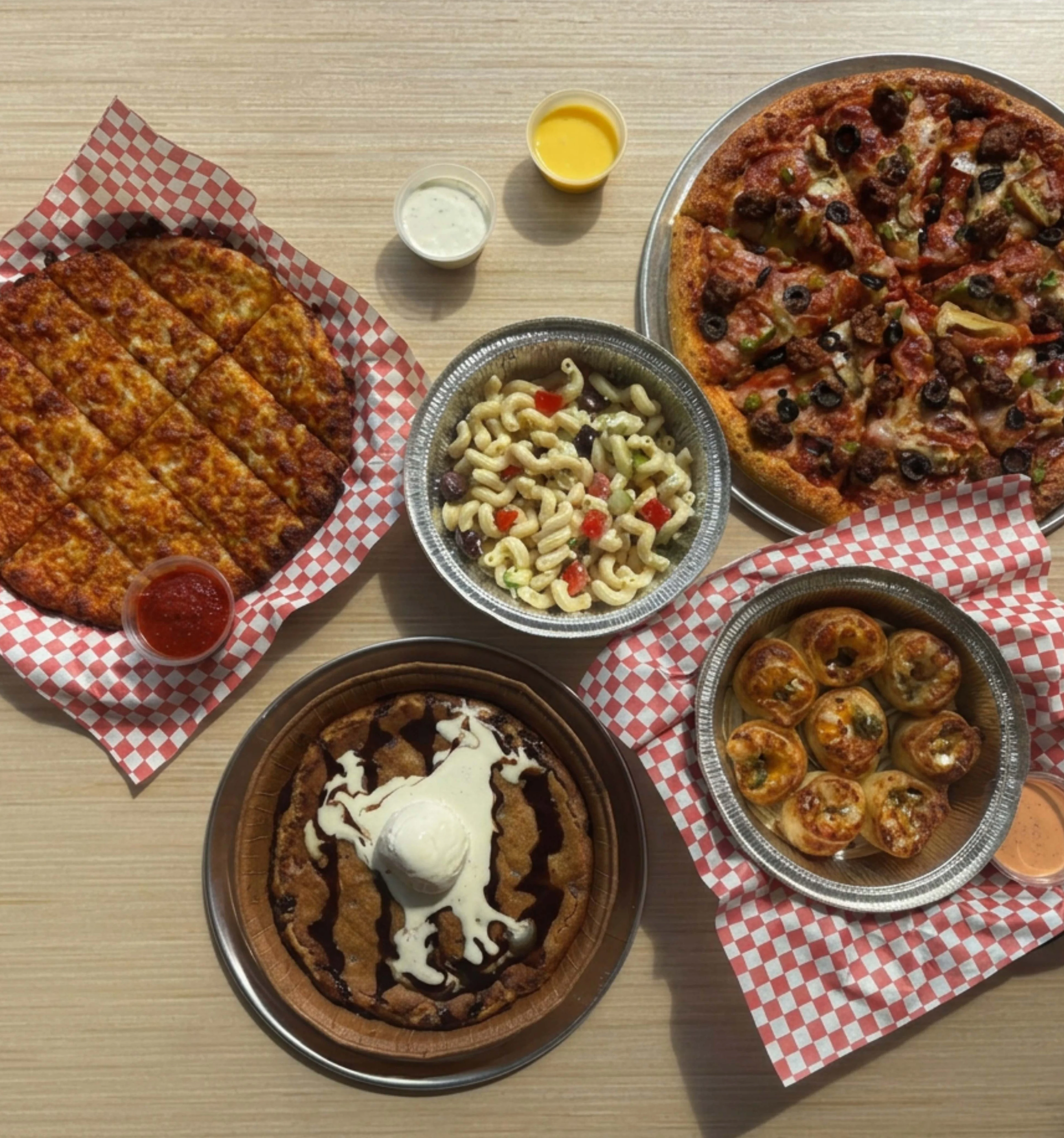 Delicious pepperoni pizza and dessert platter