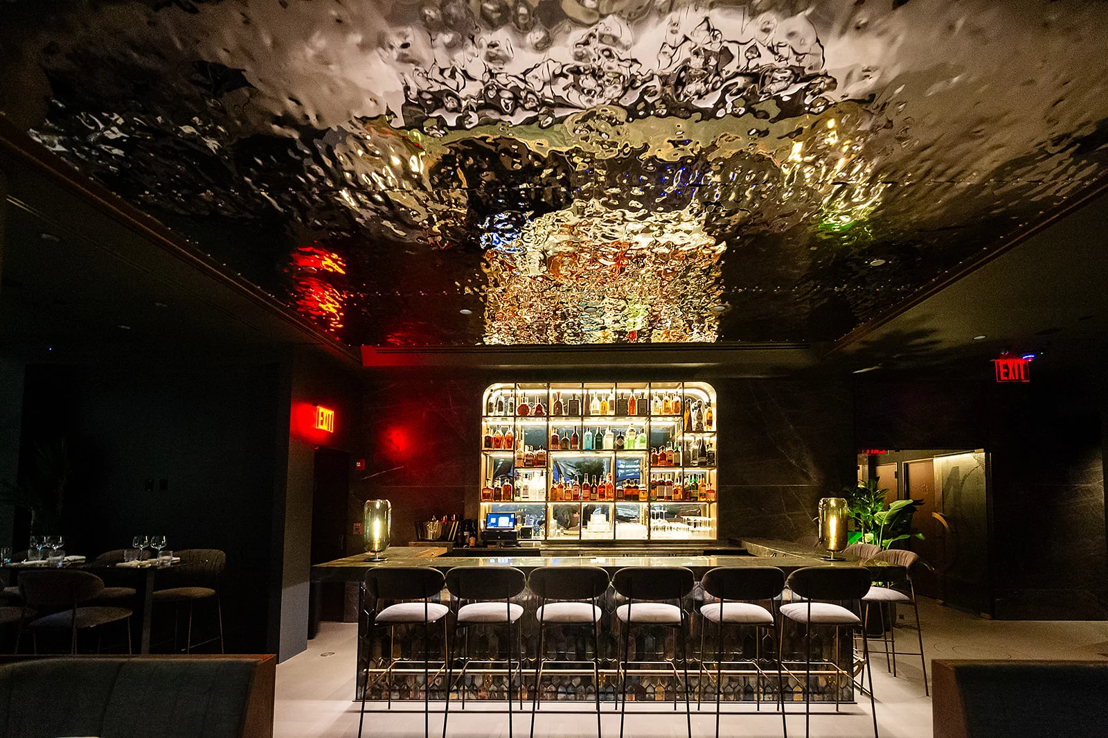 Stylish bar interior with modern decor and illuminated shelves