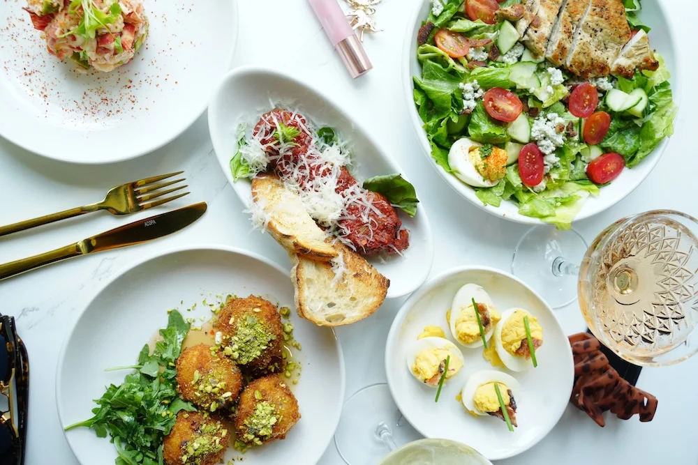 Assorted Mediterranean appetizers and salad on a dining table