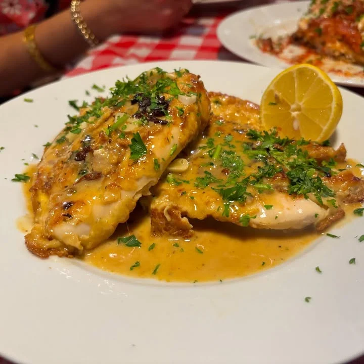 Grilled fish with lemon and herbs, a classic Italian dish