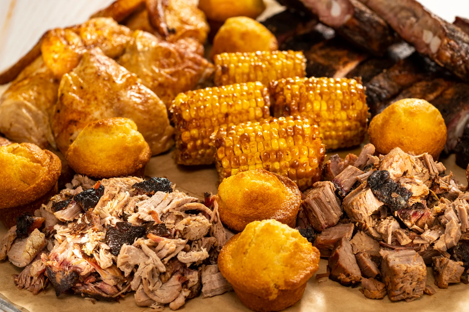 Southern barbecue platter with pulled pork and cornbread
