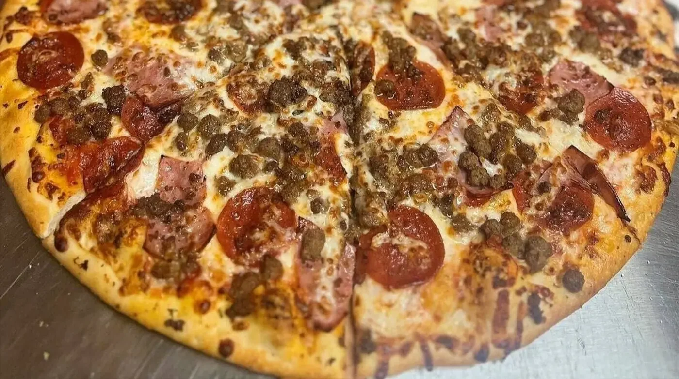 Hot fresh pizza with cheese and toppings at Buckeye Pizza & Stromboli Columbus Ohio