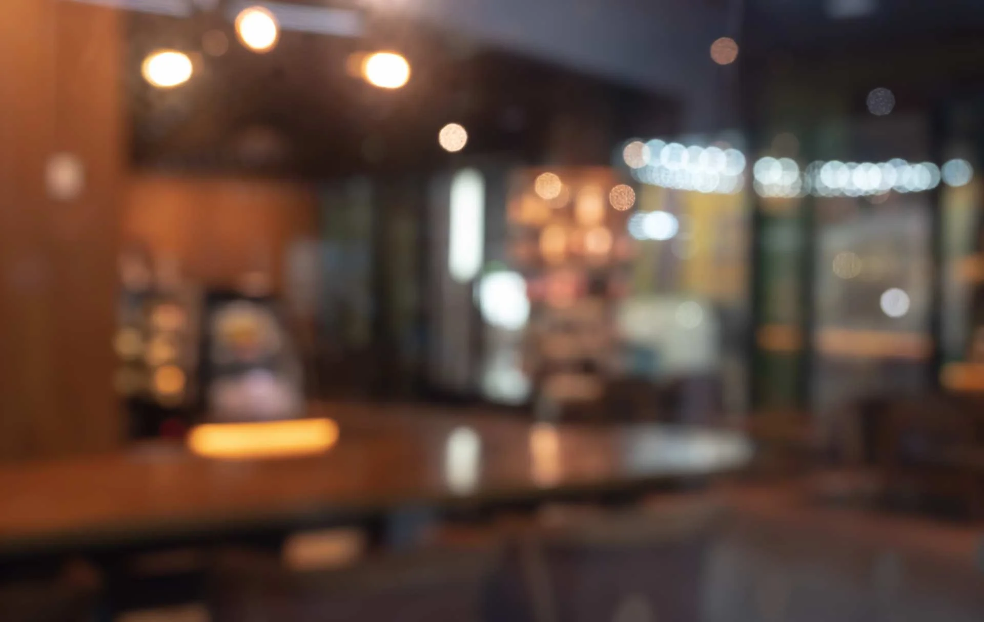 Cozy restaurant interior with warm lighting and wooden decor