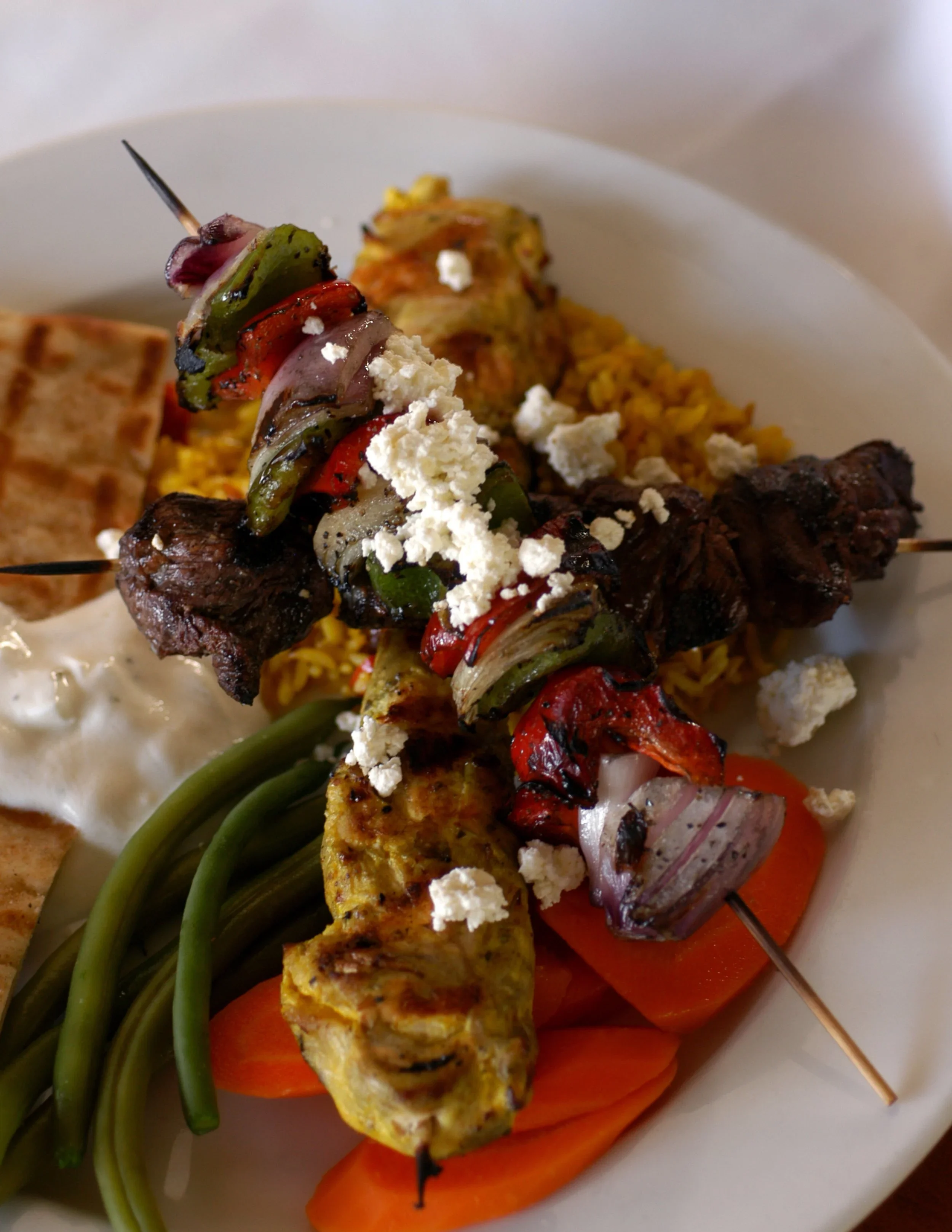 Mediterranean kebab platter with grilled meats and vegetables