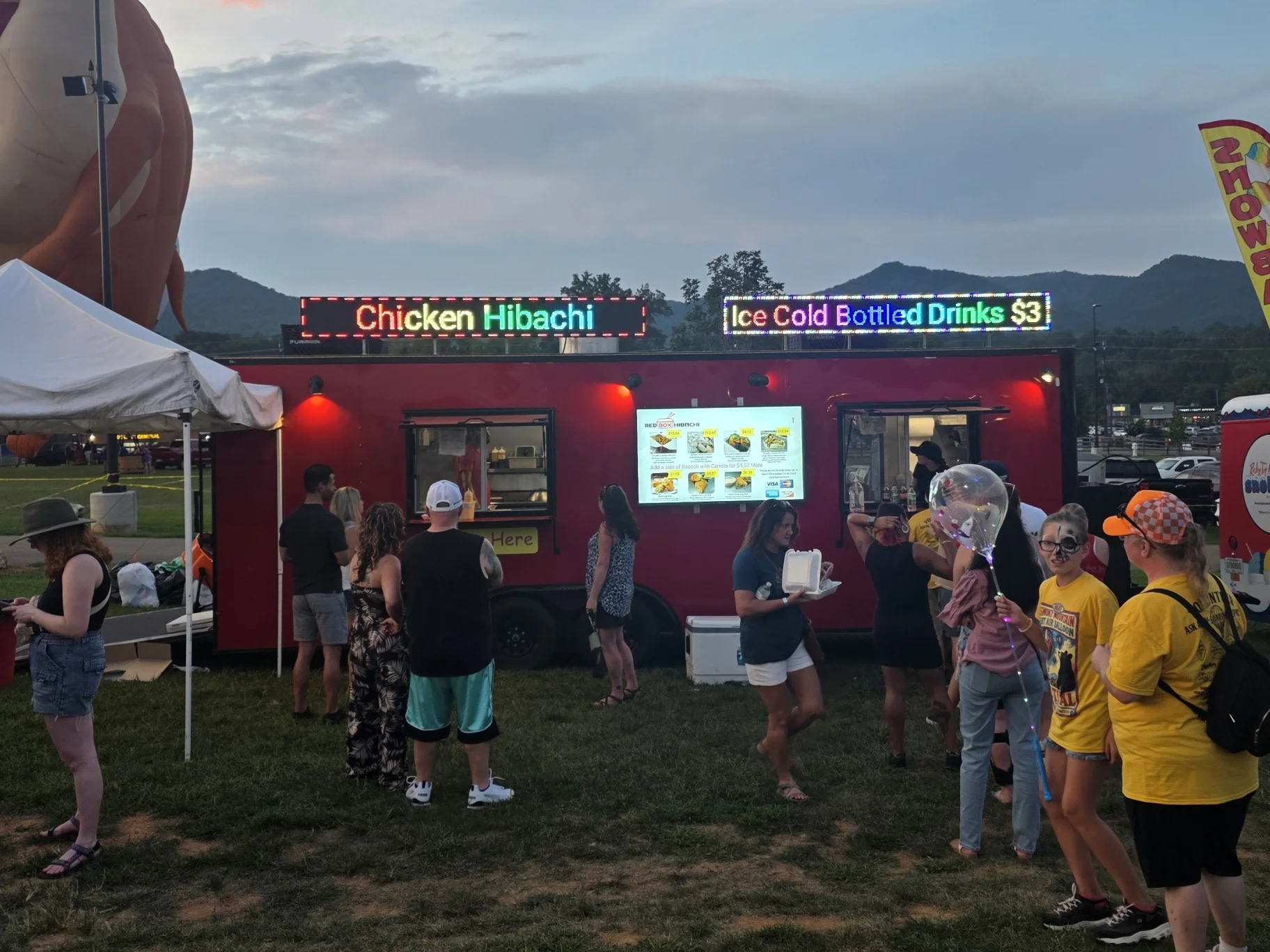 Food truck serving Chicken Hibachi at a festival