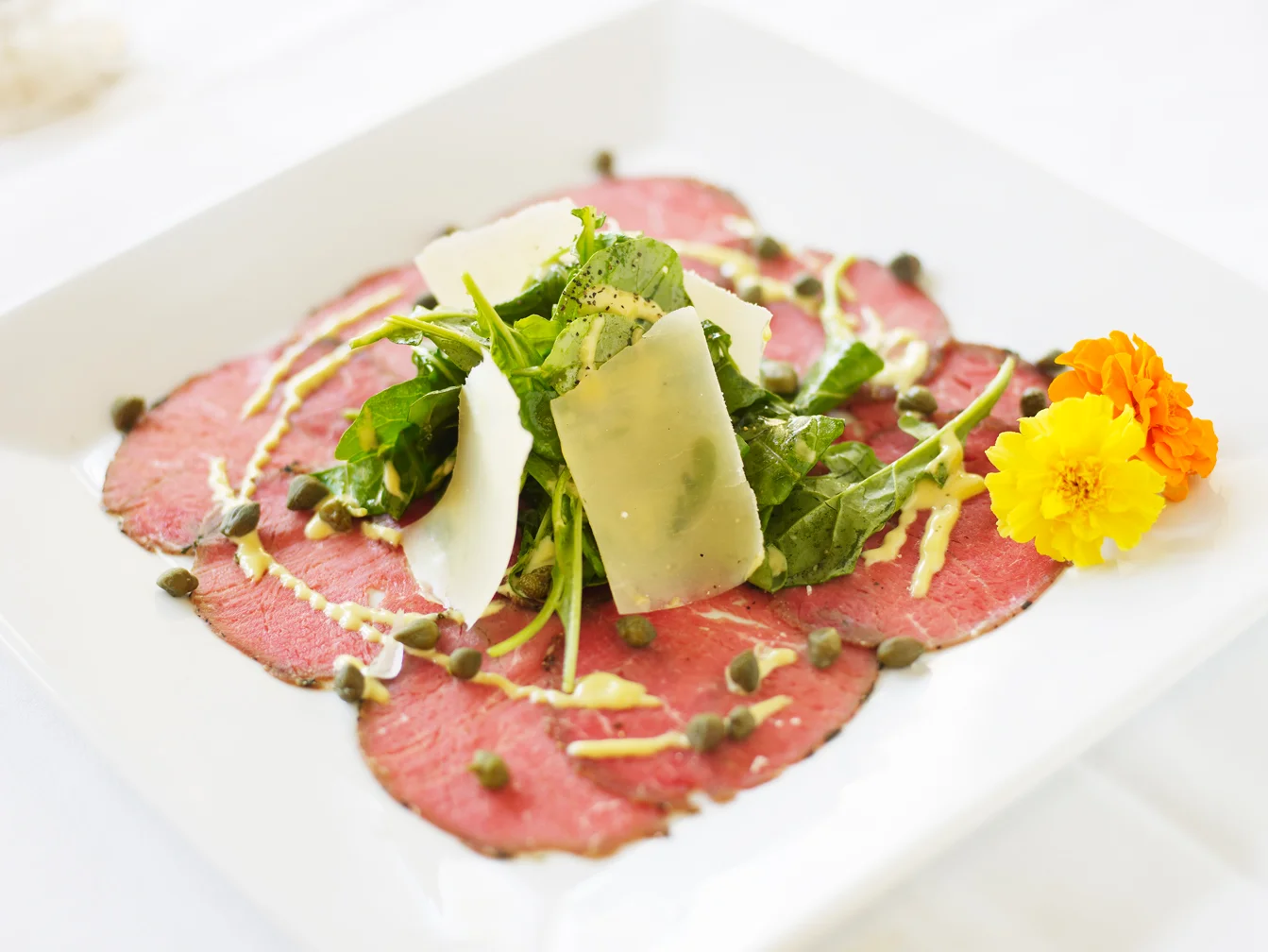 Italian carpaccio with arugula and parmesan