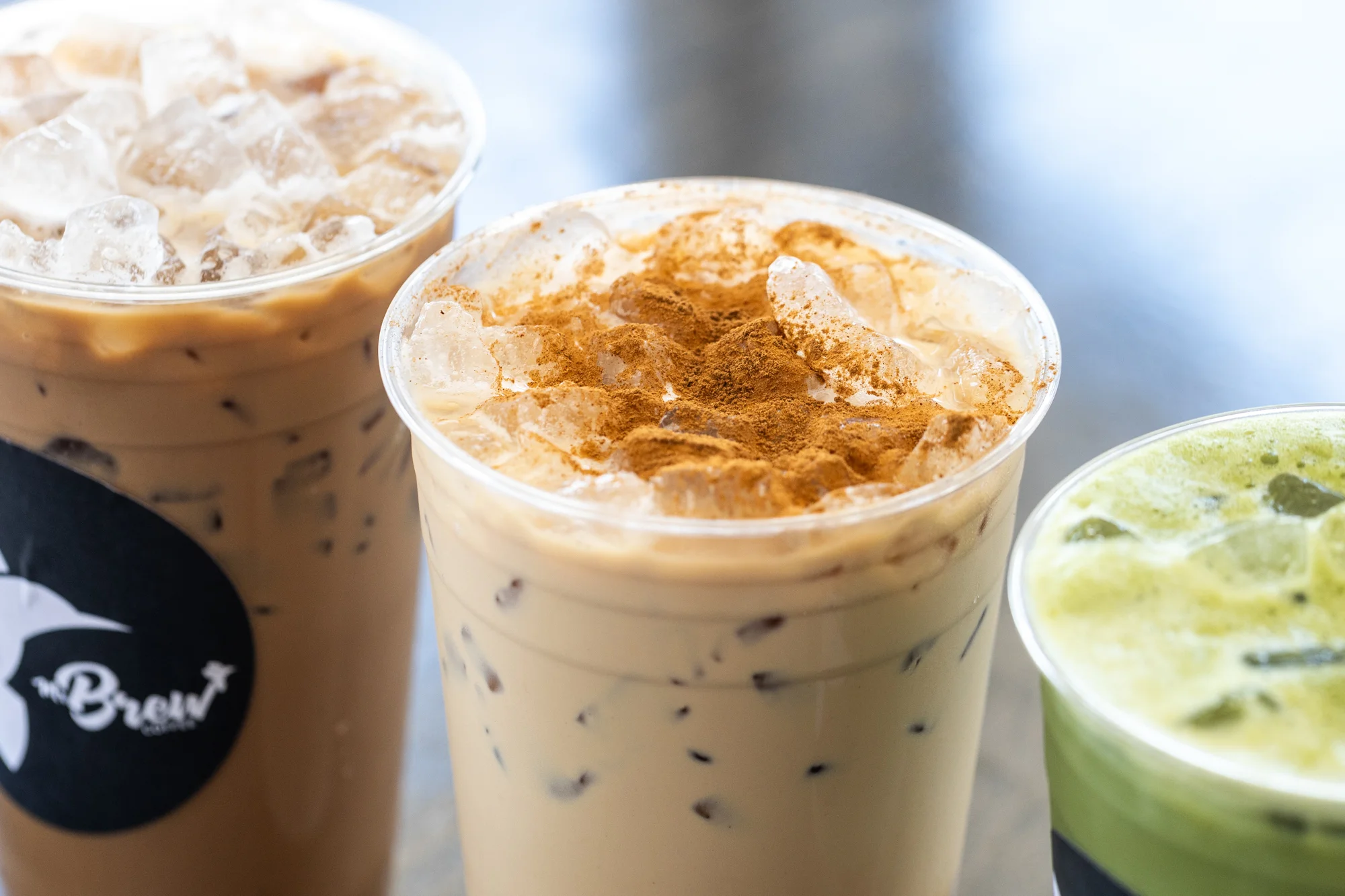 Iced coffee drinks with cinnamon and matcha
