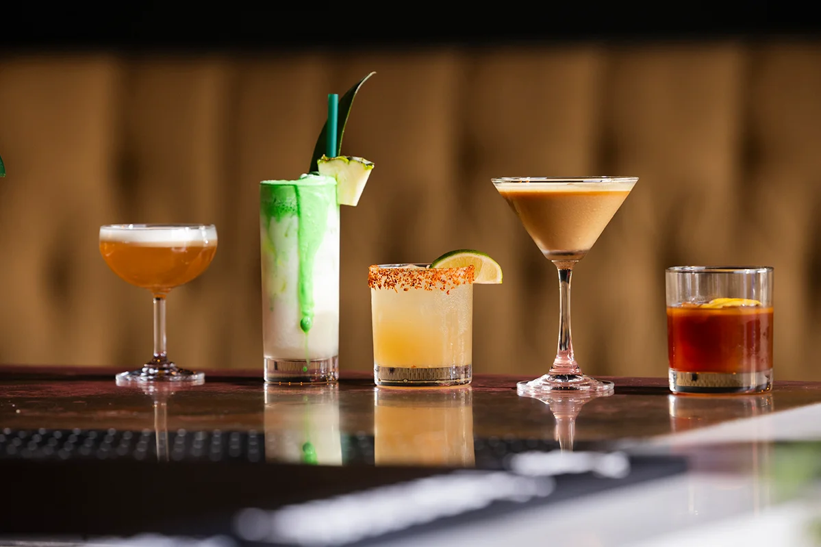 Colorful cocktails displayed on a bar counter
