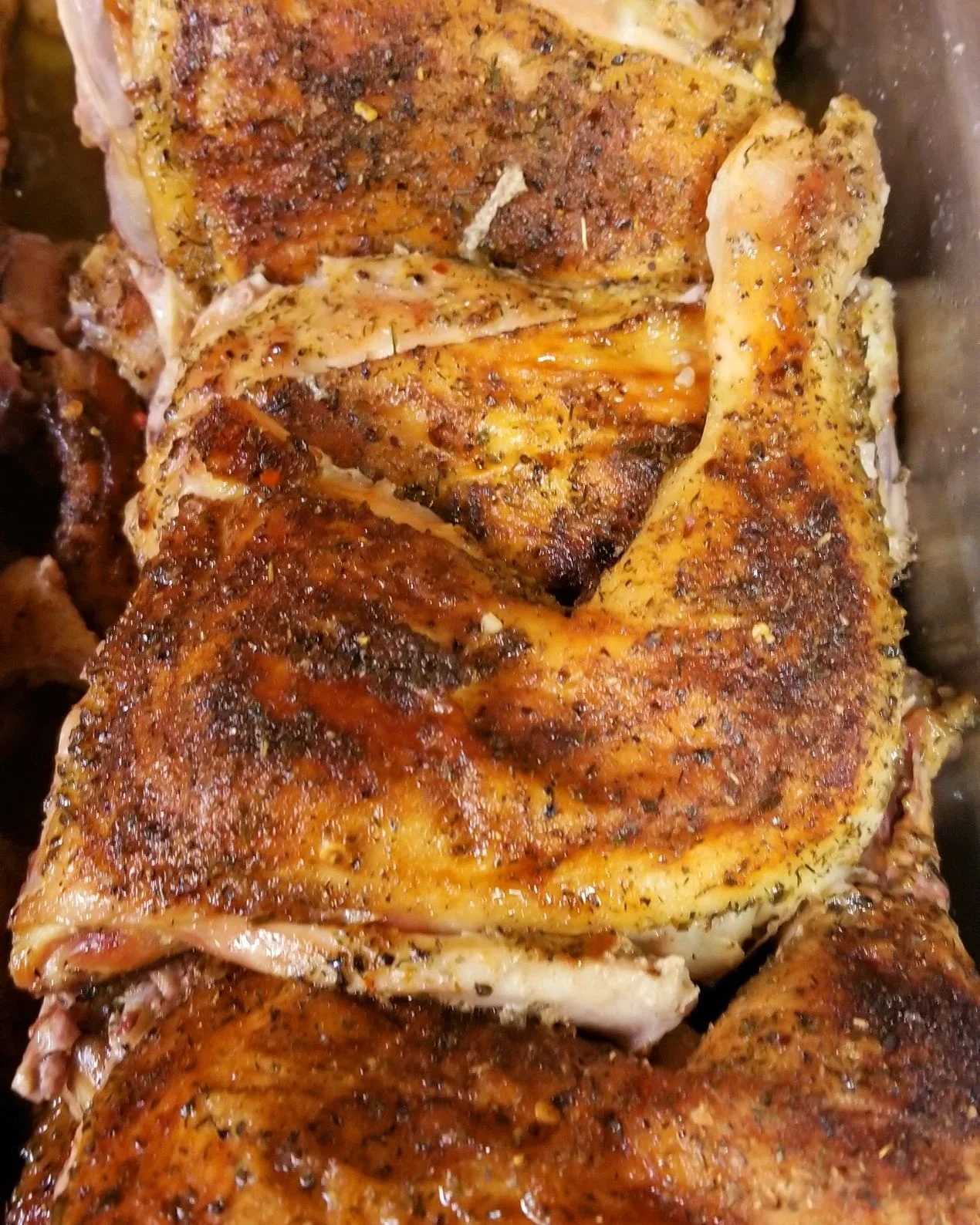 Crispy Jamaican jerk chicken pieces on a serving tray