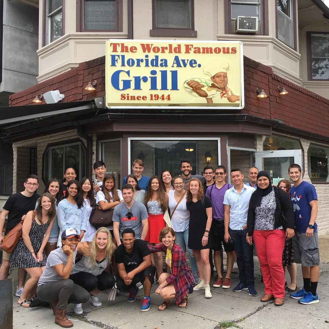Group posing outside Florida Avenue Grill restaurant in Washington, DC