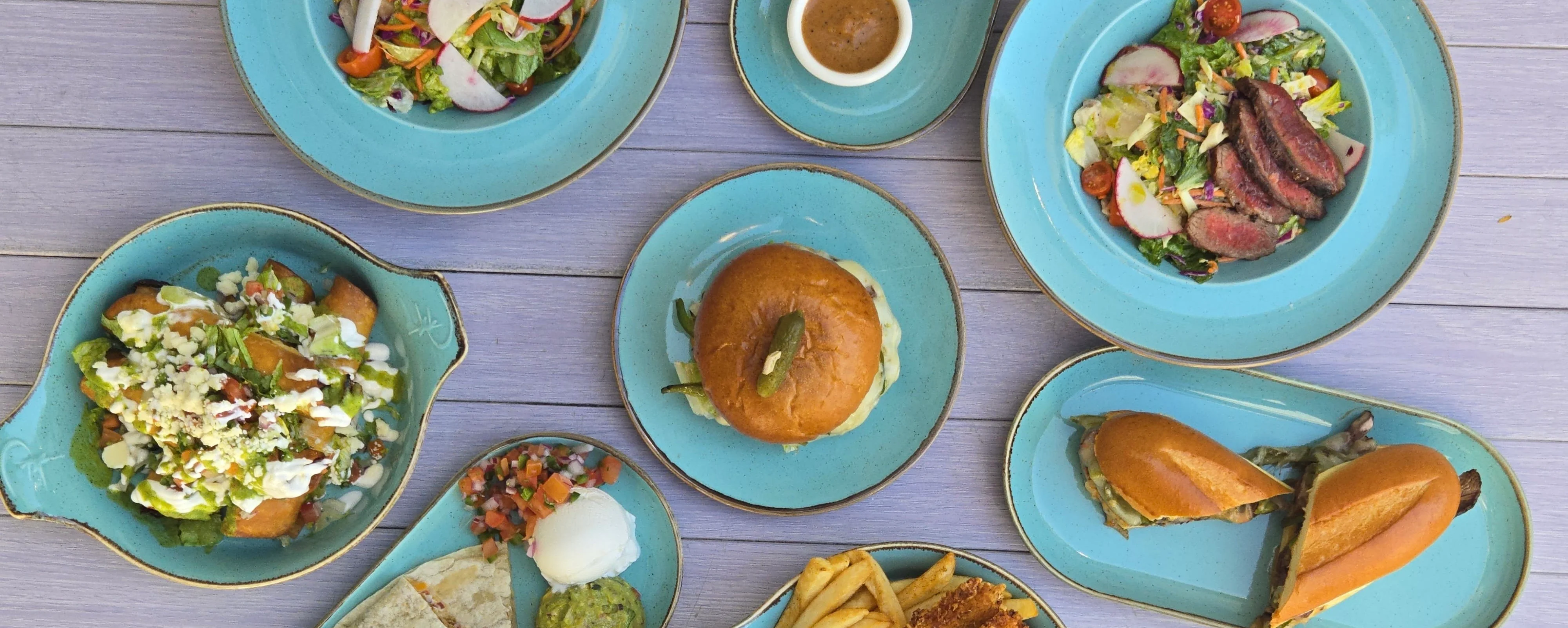 Delicious gourmet burger with fresh toppings on a wooden table