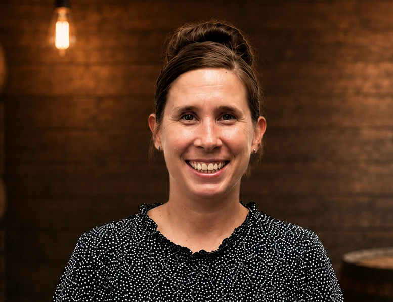 Professional woman smiling in a modern restaurant setting