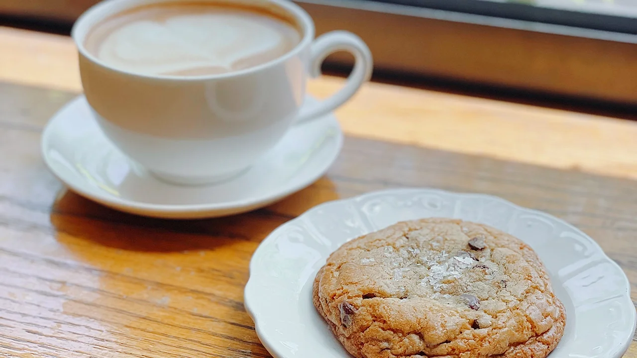 Latte and sea salt chocolate cookie at La Boulangerie & Co Logan Square café