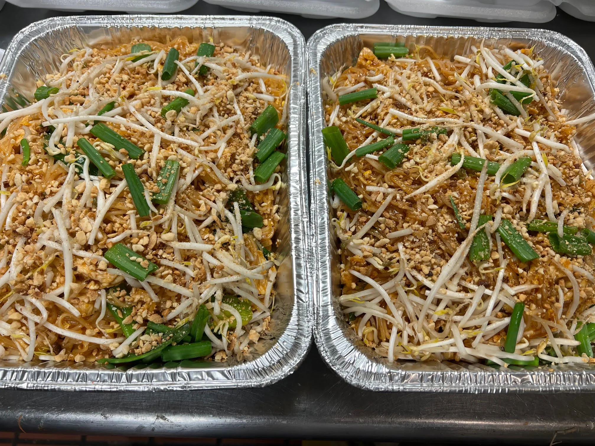 Delicious Thai pad thai garnished with peanuts and green onions