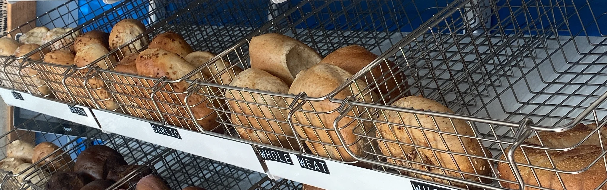 Assorted bagels displayed in a cozy café