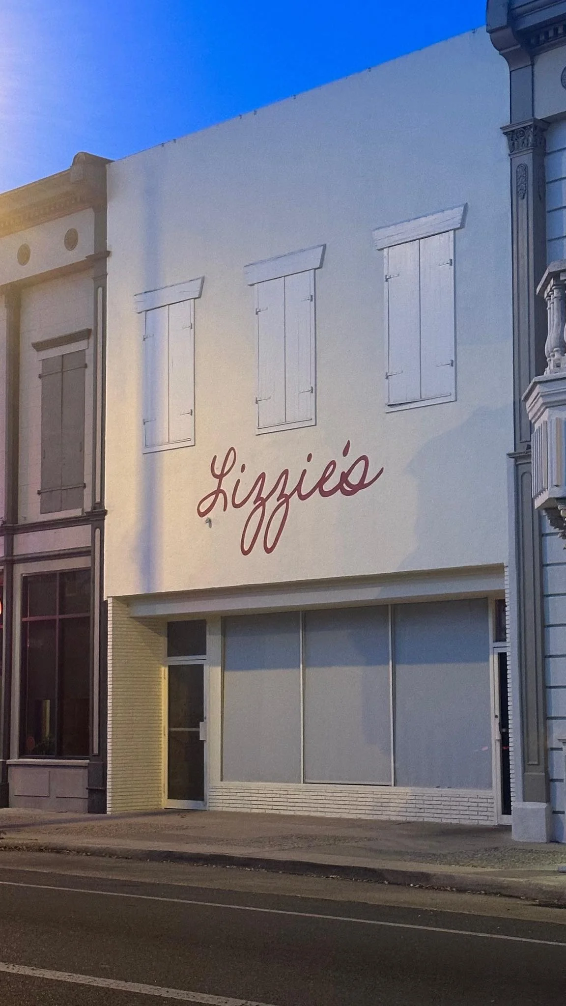 Exterior of Lizzie's restaurant with a stylish sign