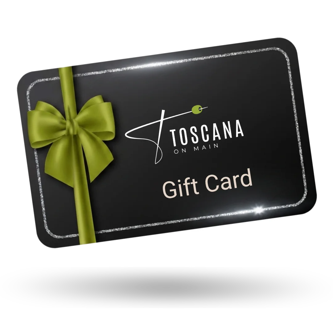 A black gift card with "Toscana on Main" logo, adorned with a green bow and silver border, exuding elegance and sophistication.
